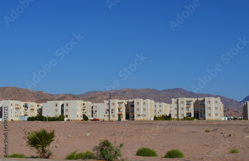 Residential buildings in the background of mountains. Dahab, Egypt.