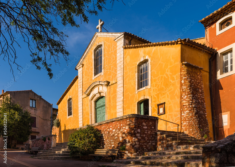 Saint-Michel church of the village of Roussillon in the Luberon valley in Provence, France 