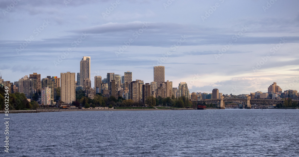 Fototapeta premium Modern City, Stanley Park, Buildings, beach and Burrard Bridge in False Creek on the West Coast of Pacific Ocean. Downtown Vancouver, British Columbia, Canada. Panoramic View. Sunset Sky