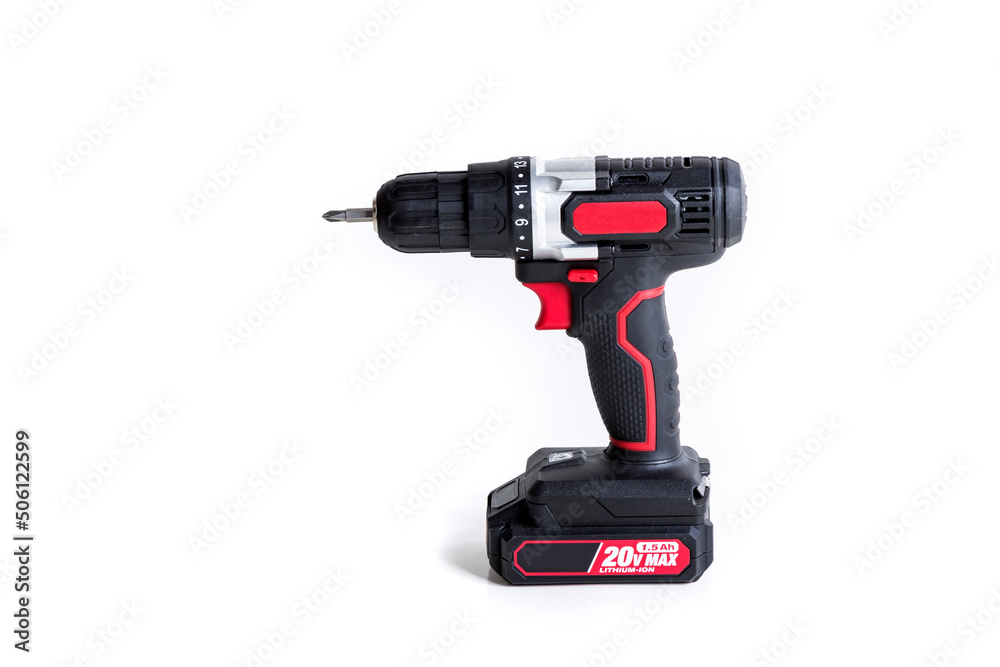 Electric screwdriver, red and black plastic cordless battery operated over a white background