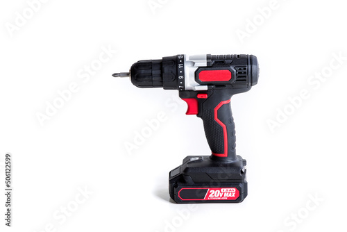 Electric screwdriver, red and black plastic cordless battery operated over a white background