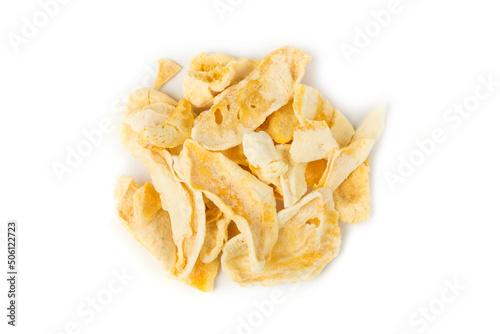 Freeze dried mango slices in a heap isolated over white. Top down view