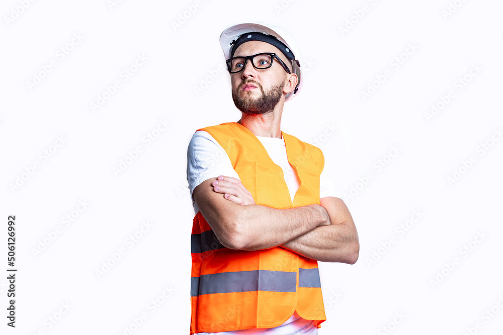 Young man with a beard in casual clothes, crossing his arms on a light background. Young man with a beard in casual clothes, crossing his arms on a light background.