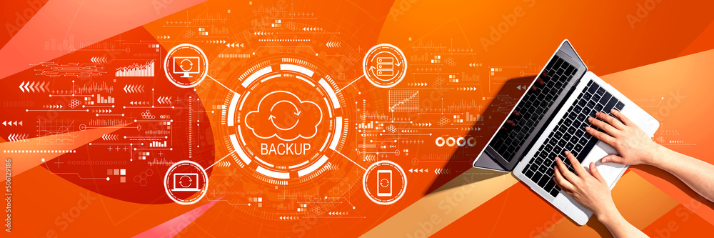 Backup concept with person using a laptop computer Backup concept with person using a laptop computer