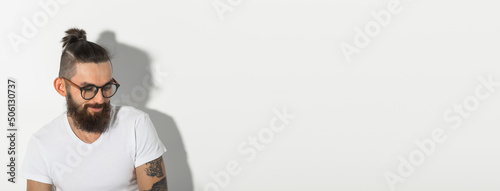 Obraz na plátně Beauty, fashion and people concept - portrait of hipster man with beard over whi