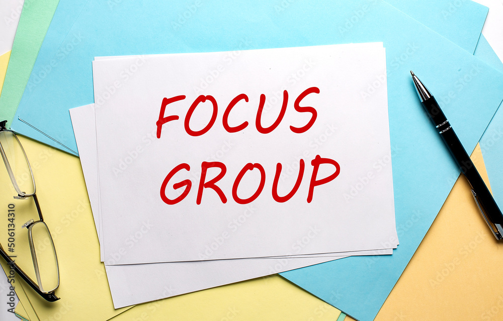 FOCUS GROUP text on paper on the colorful paper background FOCUS GROUP text on paper on the colorful paper background