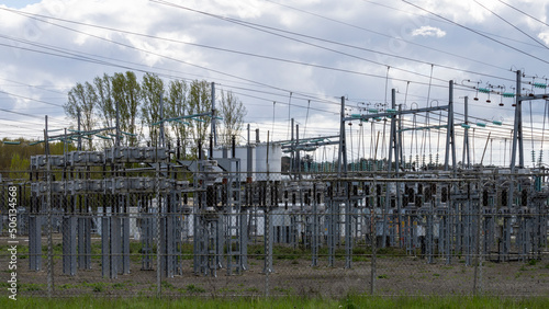 Close-up through the fence of a power plant, on a very cloudy day