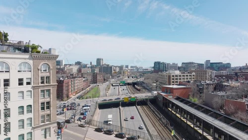 Wallpaper Mural Aerial view of traffic on Massachusetts Turnpike road in urban borough. Train driving on parallel railway track. Boston, USA Torontodigital.ca