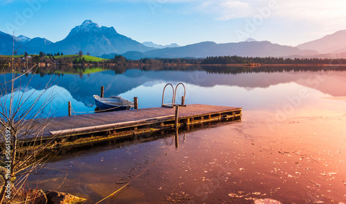 Sunset at the lake with mountains and landscape in the Allgäu photo