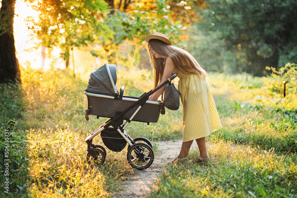 Strollers for Newborns. Keep baby safe in stroller. Mother walking with