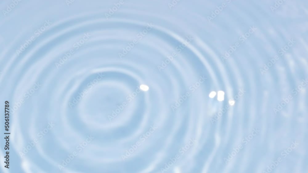 Close up view on Water texture with water circles and drops on the water overlay effect. Organic light gray drop shadow caustic effect with wave refraction of light. Slow motion video banner in blue.