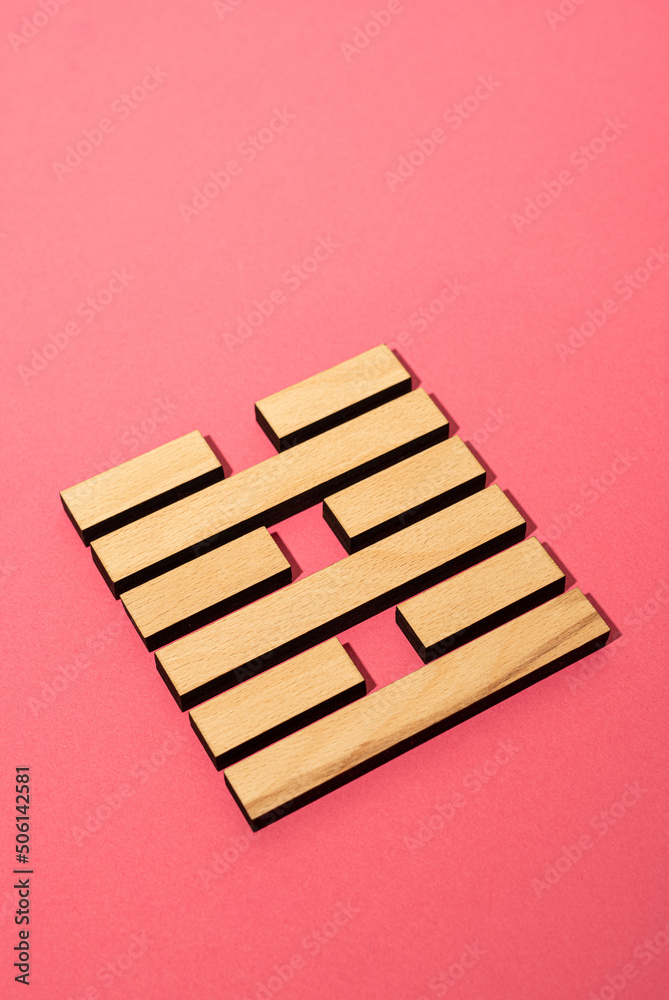 Gene Key 63 wood hexagram i ching on pink background Gene Key 63 wood hexagram i ching on pink background