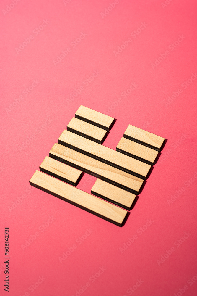 Gene Key 55 wood hexagram i ching on pink background Gene Key 55 wood hexagram i ching on pink background