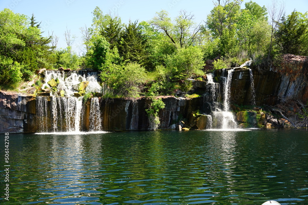 Rock formation, waterfalls, and pond at Daggett Memorial Park in Montello, Wisconsin