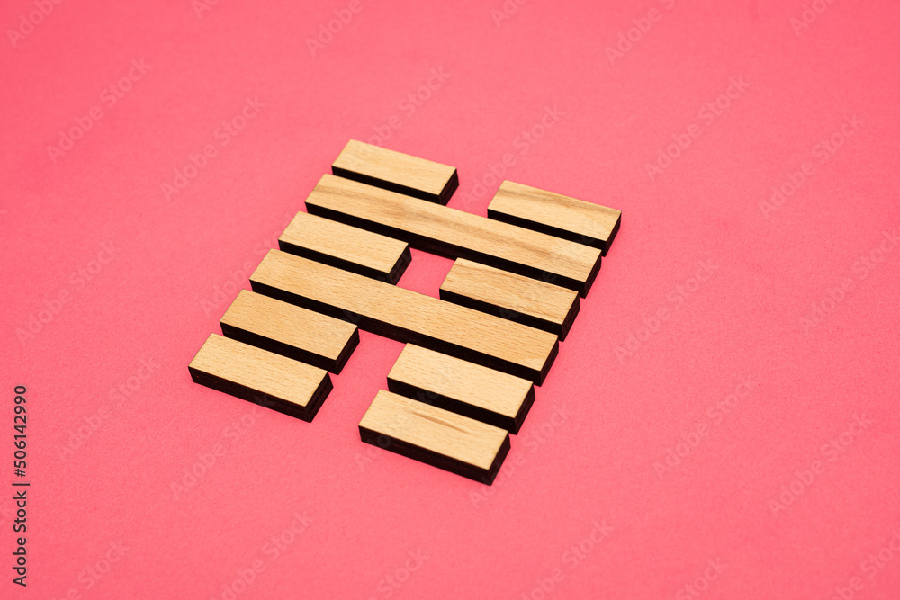 Gene Key 39 wood hexagram i ching on pink background Gene Key 39 wood hexagram i ching on pink background