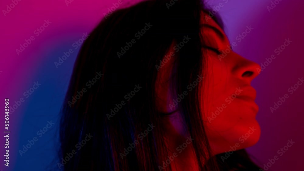 Female dancer posing against colourful background Female dancer posing against colourful background