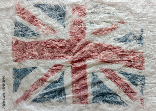 Textured background of the British flag in white, red and blue national colors. blur, defocus.