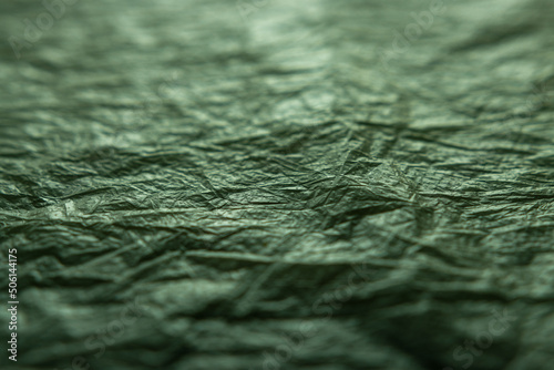 textured background in green and gray tones. blur, defocus.