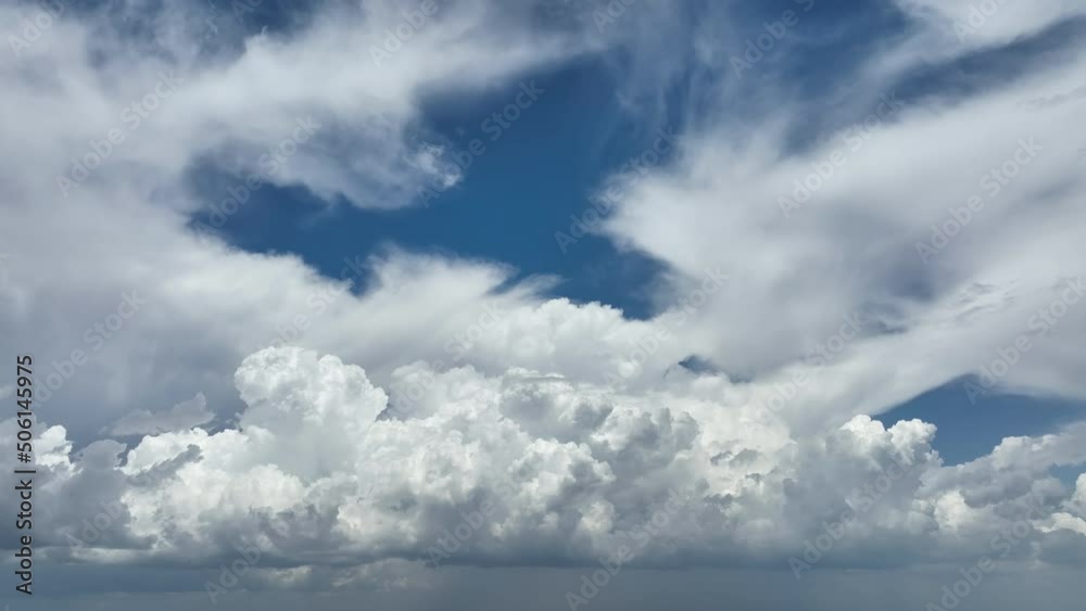 Timelapse of white puffy cumulus clouds forming on summer blue sky. Moving and changing cloudscape weather Timelapse of white puffy cumulus clouds forming on summer blue sky. Moving and changing cloudscape weather