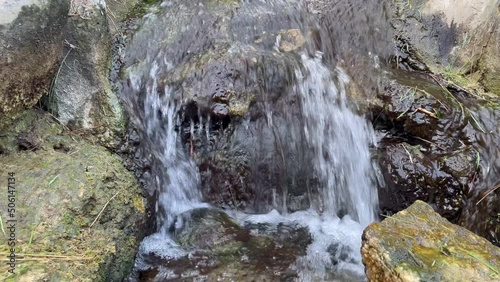 Flowing Water on a Small Cascade in the Buenos Aires Japanese Garden (Jardin Japones), Public Garden in Buenos Aires, Argentina. 4K Resolution. photo