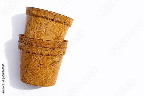 Coco coir pots on white background. photo