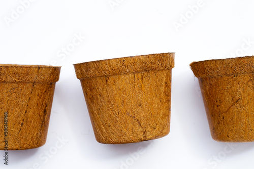 Coco coir pots on white background. photo