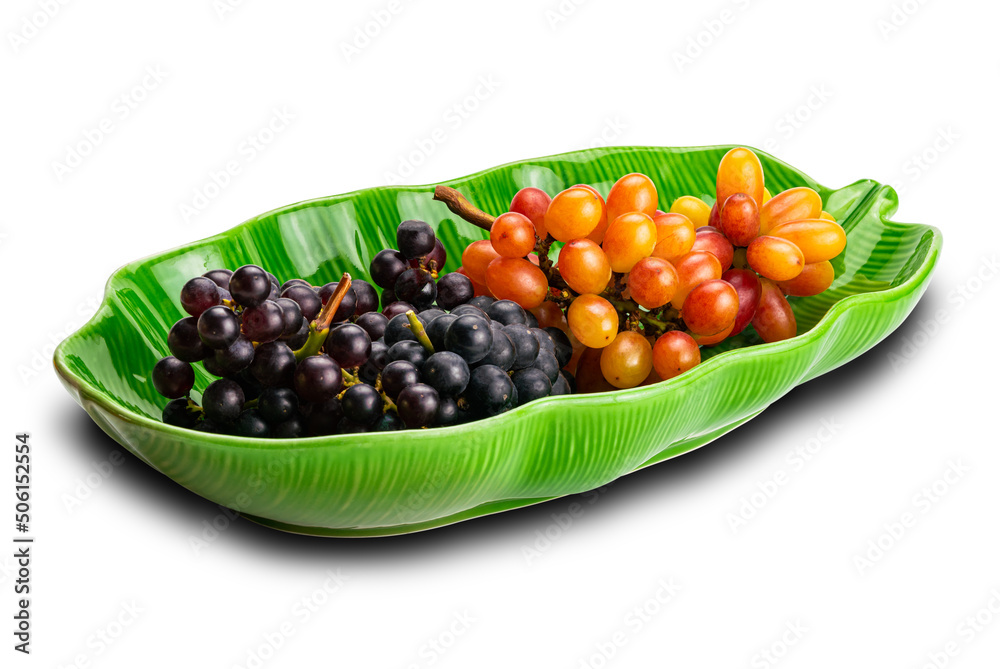 Bunches of ripe red grapes, black grapes and purple grapes in green ceramic plate isolated on white background. Bunches of ripe red grapes, black grapes and purple grapes in green ceramic plate isolated on white background.