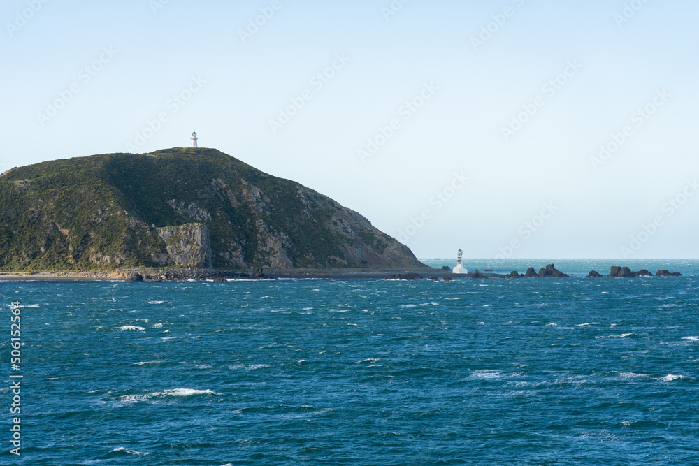 Pencarrow Heads lighthouses and coastal scene when leaving Wellington harbour