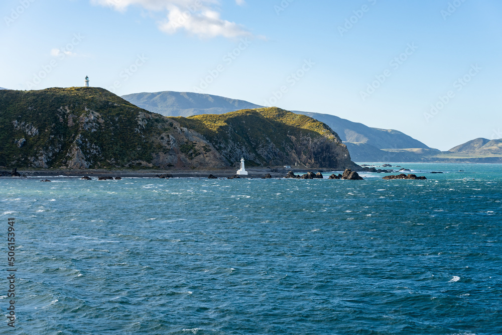Pencarrow Heads lighthouses and coastal scene when leaving Wellington harbour