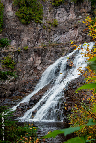 Beautiful Caribou Falls flowing down on the Caribou River in the fall in the Superior National forest
