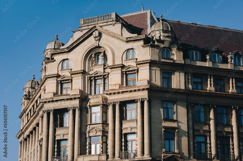 An old European house in neoclassical style with decor on the cornices, columns and skylights. Lvov, Ukraine.