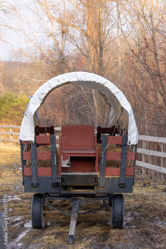 Close up view of old covered wagon in the farm © SNEHIT PHOTO