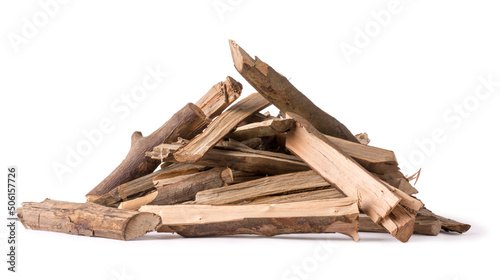pile of chopped firewood pieces, alternative fuel isolated on white background, closeup