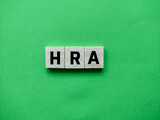 The word HRA or Health Reimbursement Arrangement is a green background.Medical concept.