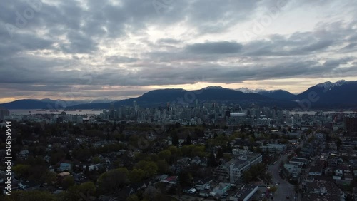 Fly over highwway in Vancouver during sunset with a beautiful mountains photo