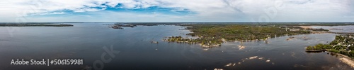 Georigian bay  drone photos with beaches and islands  by waubaushene beach going into lake huron with clouds and blue skies  photo