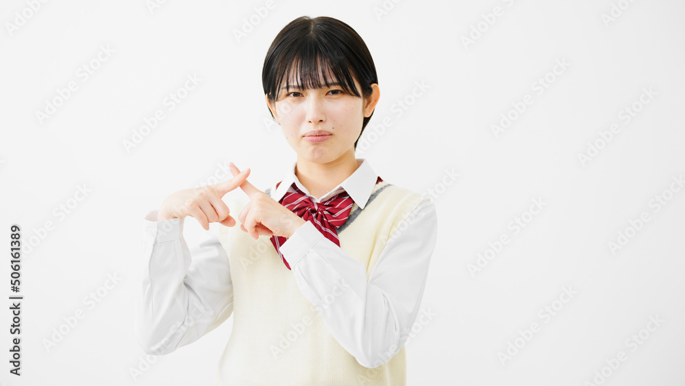 NGサインをする女子高校生
