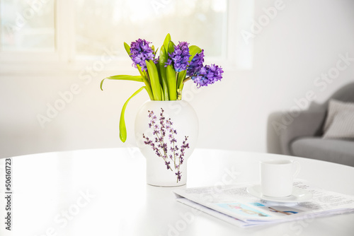 Stylish vase with hyacinth ...