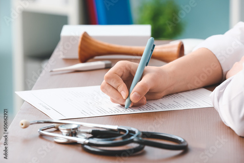Female doctor working with ...