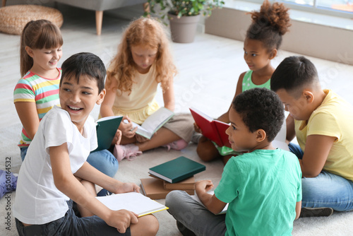Little children reading boo...