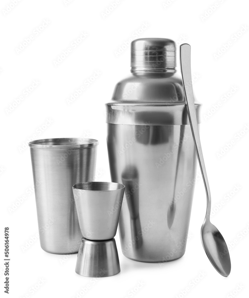 Double jigger, mixing spoon, cobbler and cocktail shakers on white background Double jigger, mixing spoon, cobbler and cocktail shakers on white background