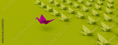 Success Concept with Origami Birds on a Green background.  photo