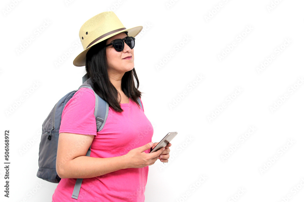 Latin adult woman with sunglasses, hat and pink shirt uses her cell phone to locate herself on a map app as a tourist while discovering a new place on vacation
Latin adult woman with sunglasses, hat and pink shirt uses her cell phone to locate herself on a map app as a tourist while discovering a new place on vacation