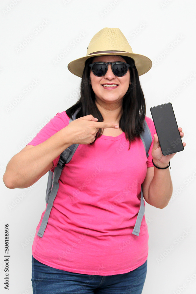 Latin adult woman with sunglasses, hat and pink shirt uses her cell phone to locate herself on a map app as a tourist while discovering a new place on vacation
Latin adult woman with sunglasses, hat and pink shirt uses her cell phone to locate herself on a map app as a tourist while discovering a new place on vacation