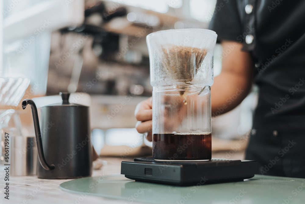 Barista making coffee by pour over in coffee shop.. Close up of hands barista to making a drip coffee. Coffee shop concept Barista making coffee by pour over in coffee shop.. Close up of hands barista to making a drip coffee. Coffee shop concept