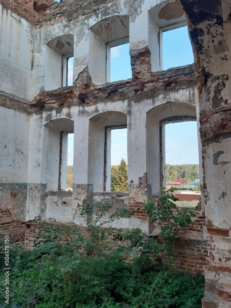 the gaping emptiness of the windows of the crumbling temple