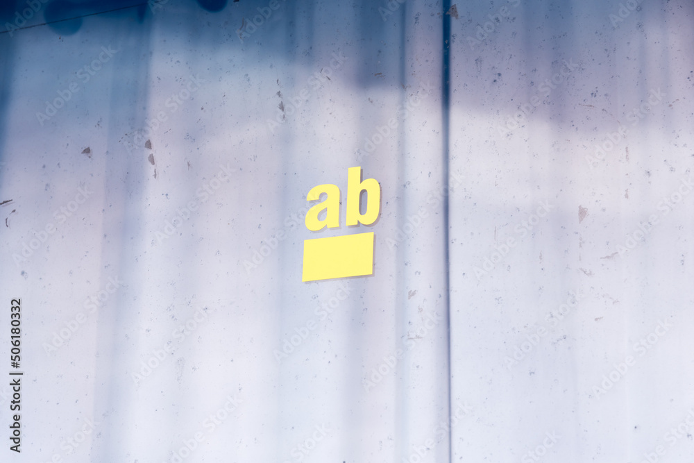 The word from as the remainder of a lettering in a shop window with a blue curtain in German The word from as the remainder of a lettering in a shop window with a blue curtain in German