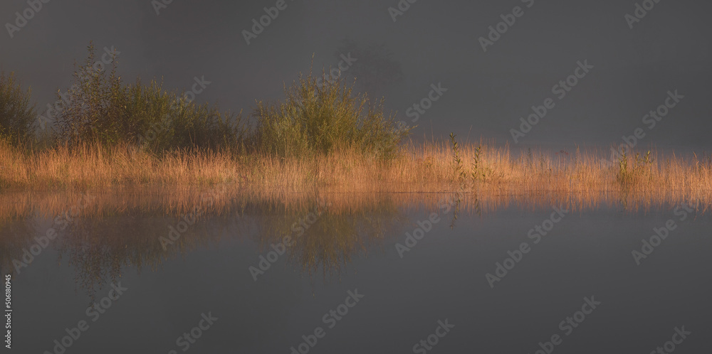 Autumn mist by the lake with beautiful calm reflections. Autumn mist by the lake with beautiful calm reflections.
