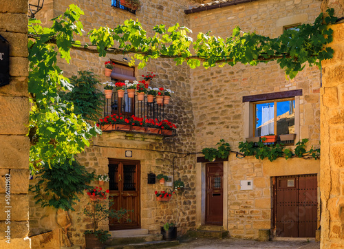 Fototapeta Naklejka Na Ścianę i Meble -  Old stone houses and narrow cobblestone streets in a picturesque medieval village of Ujue in the Basque Country, Navarra, Spain