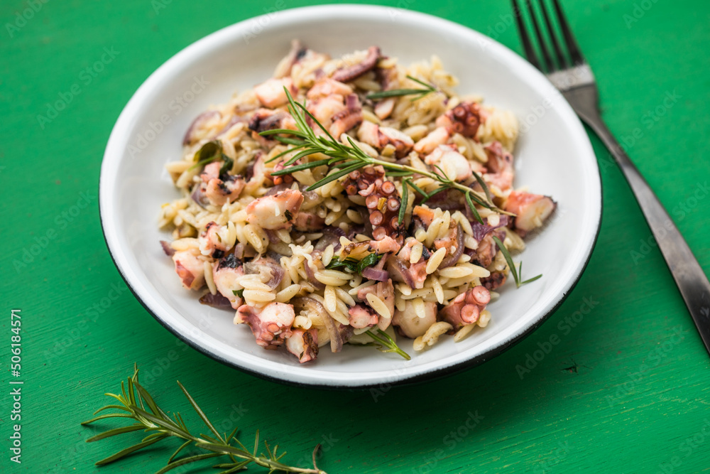 fresh and tasty true Greek kritharaki with octopus fresh and tasty true Greek kritharaki with octopus